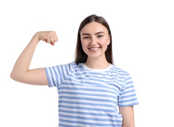 Photo of Strength. Happy woman showing her biceps on white background