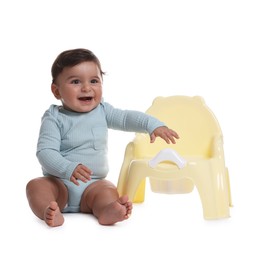 Photo of Cute little baby sitting near potty on white background