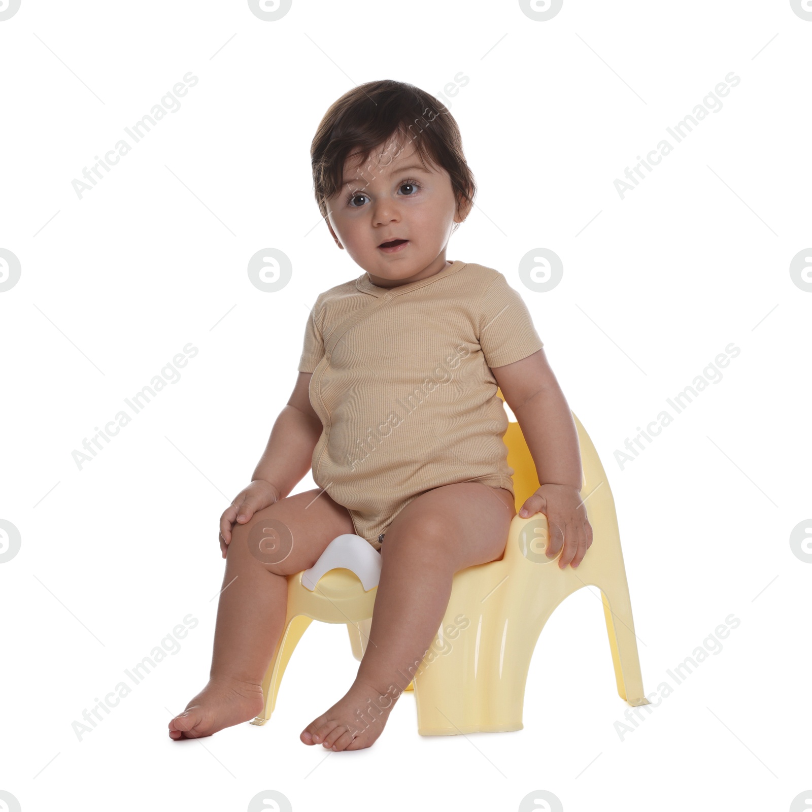 Photo of Cute little baby sitting on potty against white background