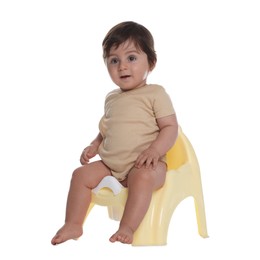 Photo of Cute little baby sitting on potty against white background