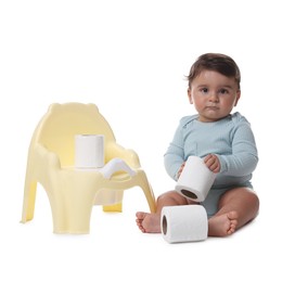 Photo of Cute little baby with rolls of toilet paper near potty on white background