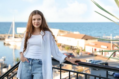 Photo of Portrait of beautiful teenage girl at sea resort