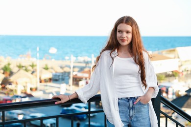 Photo of Portrait of beautiful teenage girl at sea resort