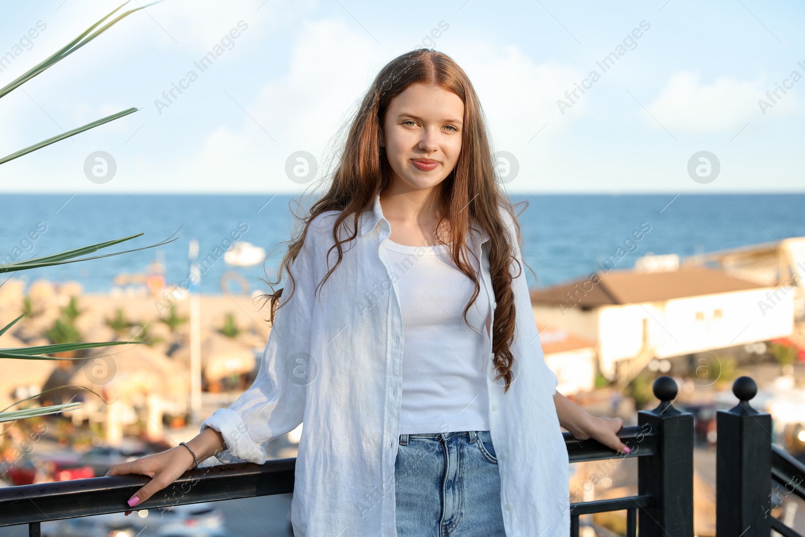 Portrait of beautiful teenage girl at sea resort Photo of Portrait of beautiful teenage girl at sea resort