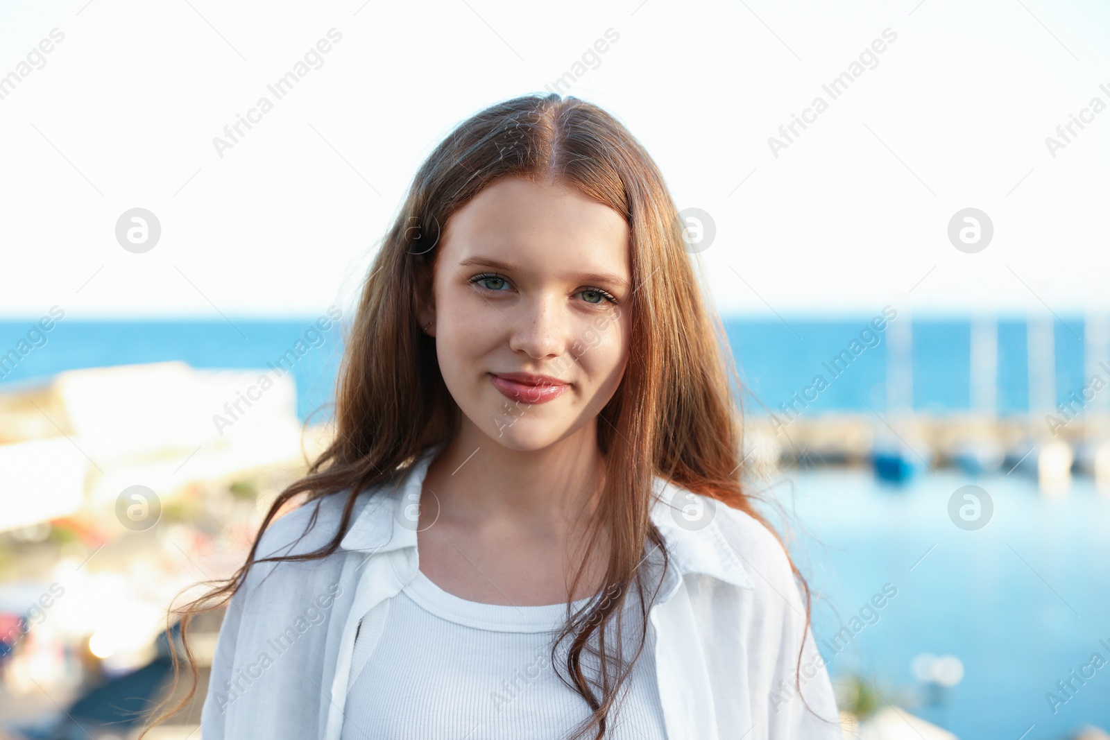 Portrait of beautiful teenage girl at sea resort Photo of Portrait of beautiful teenage girl at sea resort