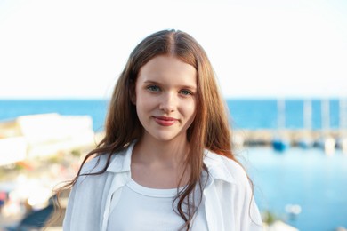 Photo of Portrait of beautiful teenage girl at sea resort