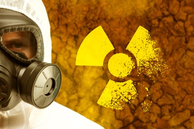 Image of Radioactive hazard, warning sign. Man in hazmat suit and gas mask against polluted soil