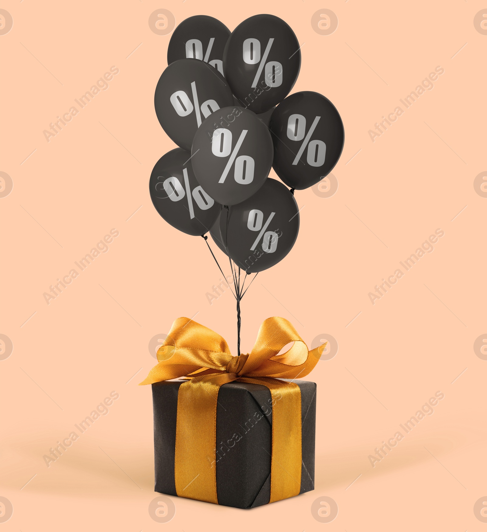 Black balloons with percent signs and gift box on pink beige background. Hot sale, special offer Image of Black balloons with percent signs and gift box on pink beige background. Hot sale, special offer