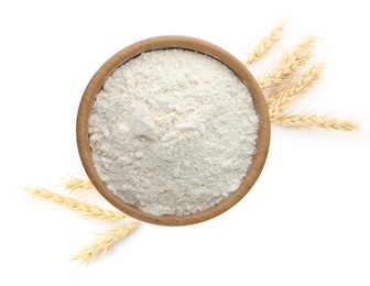 Image of Wheat flour in bowl and spikelets on white background, top view