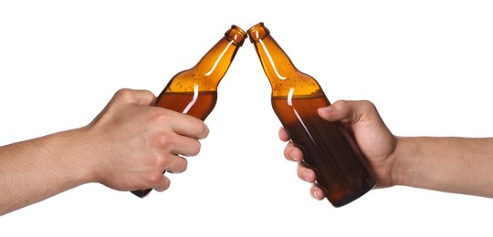 Image of Men clinking their bottles of beer together against white background