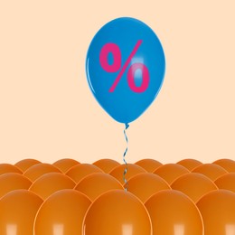 Image of Blue balloon with percent sign above orange ones against beige background. Hot sale, special offer