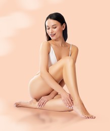 Image of Epilation. Woman showing smooth skin after hair removal against beige background