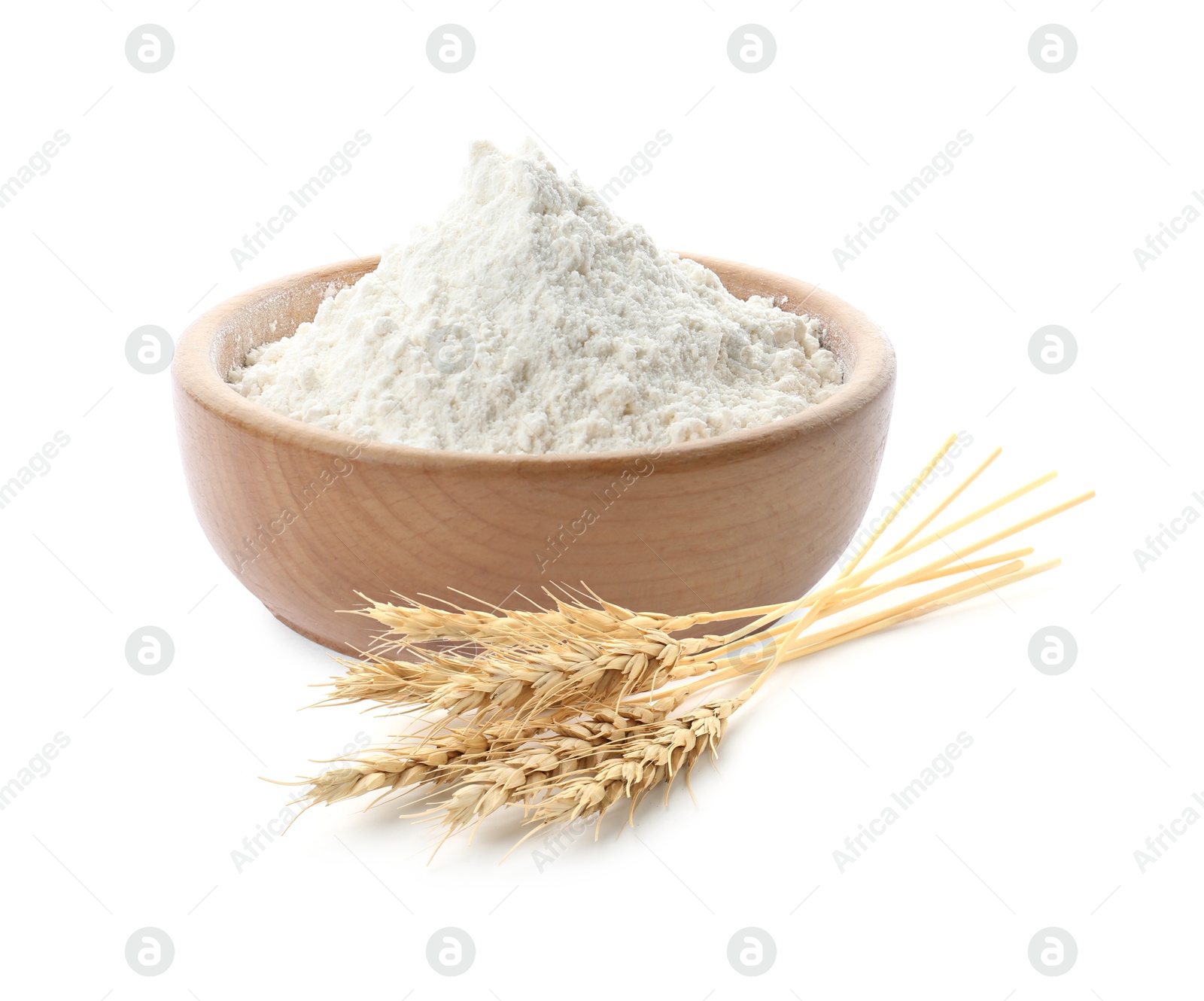 Image of Wheat flour in bowl and spikelets on white background