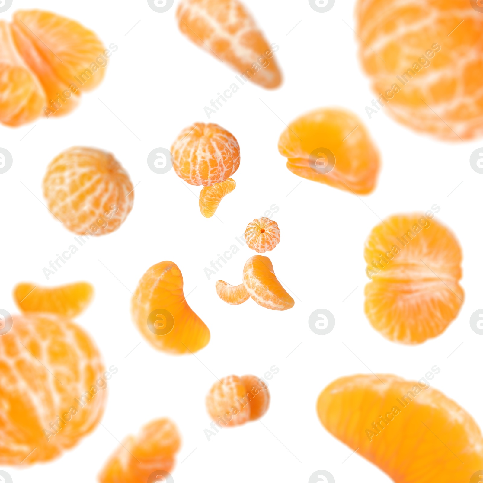 Image of Sweet tangerines whirling in air against white background