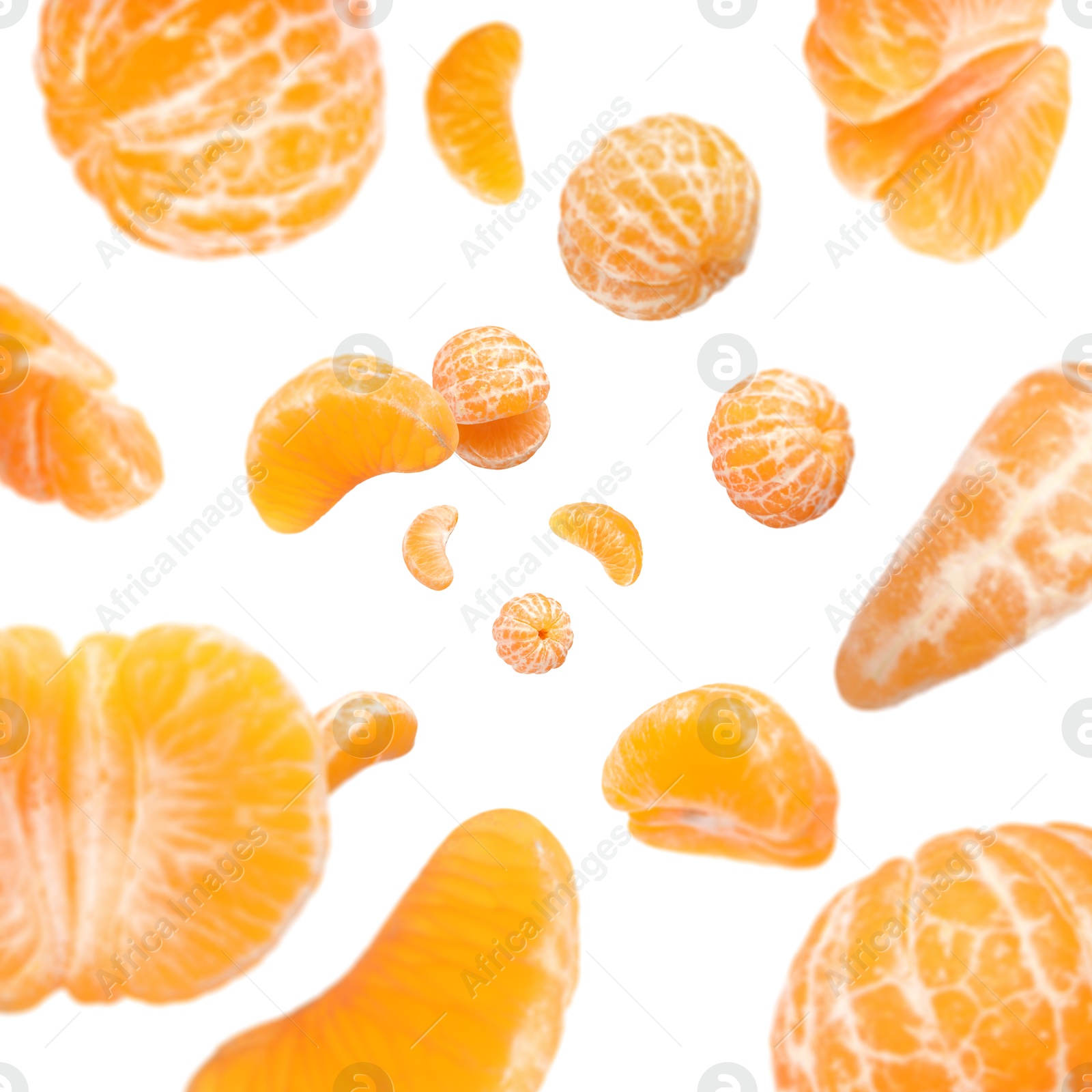 Image of Sweet tangerines whirling in air against white background