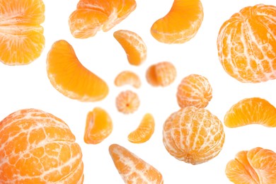 Image of Sweet tangerines whirling in air against white background