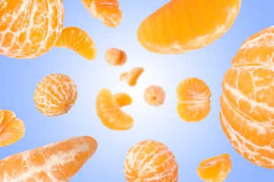 Image of Sweet tangerines whirling in air against blue gradient background