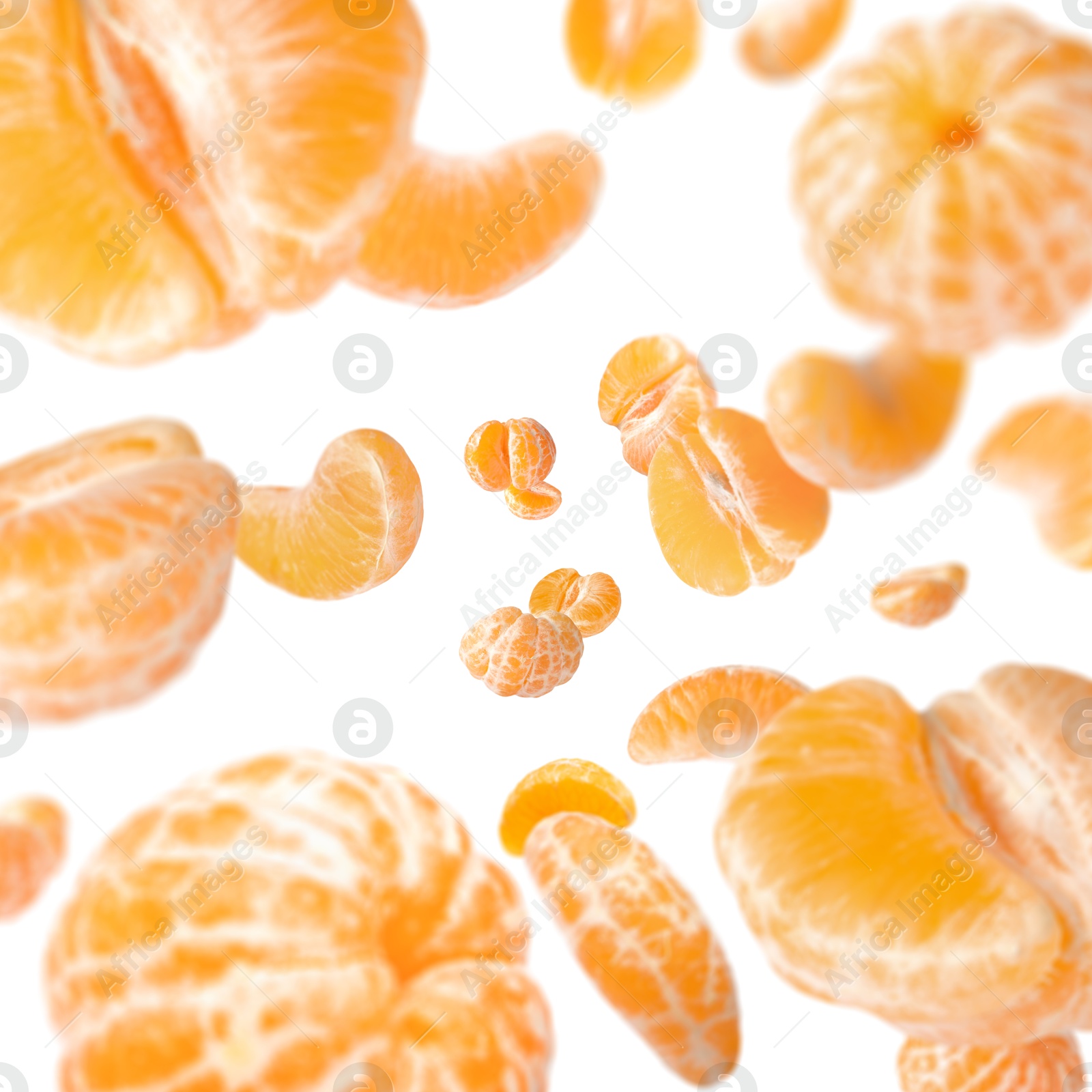 Image of Sweet tangerines whirling in air against white background