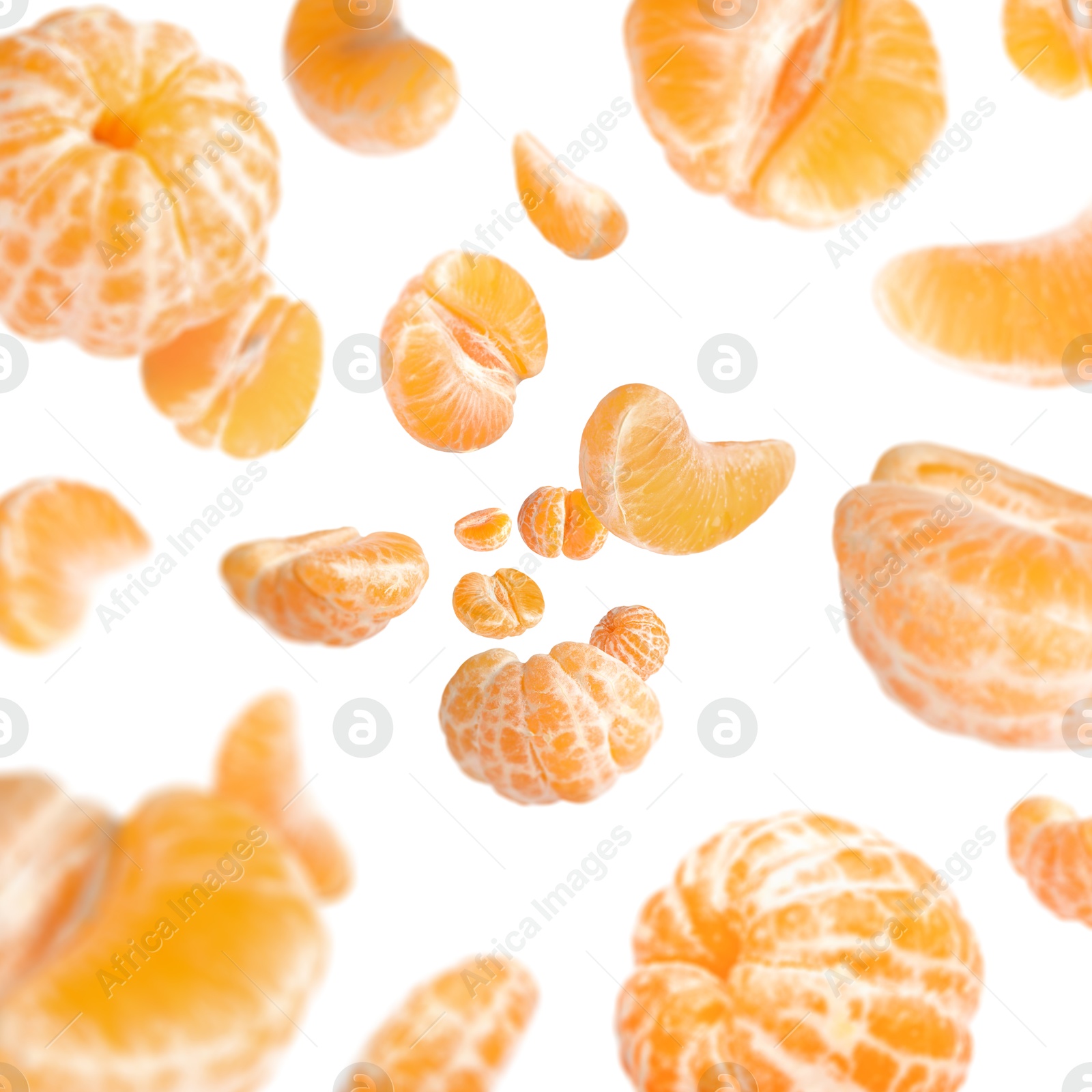 Image of Sweet tangerines whirling in air against white background