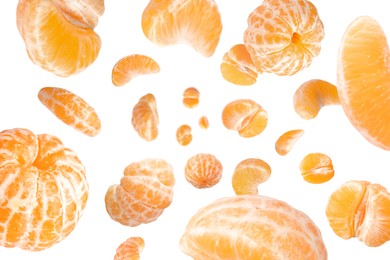 Image of Sweet tangerines whirling in air against white background