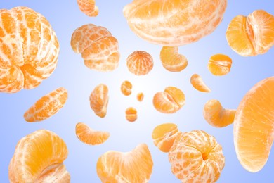 Image of Sweet tangerines whirling in air against blue gradient background