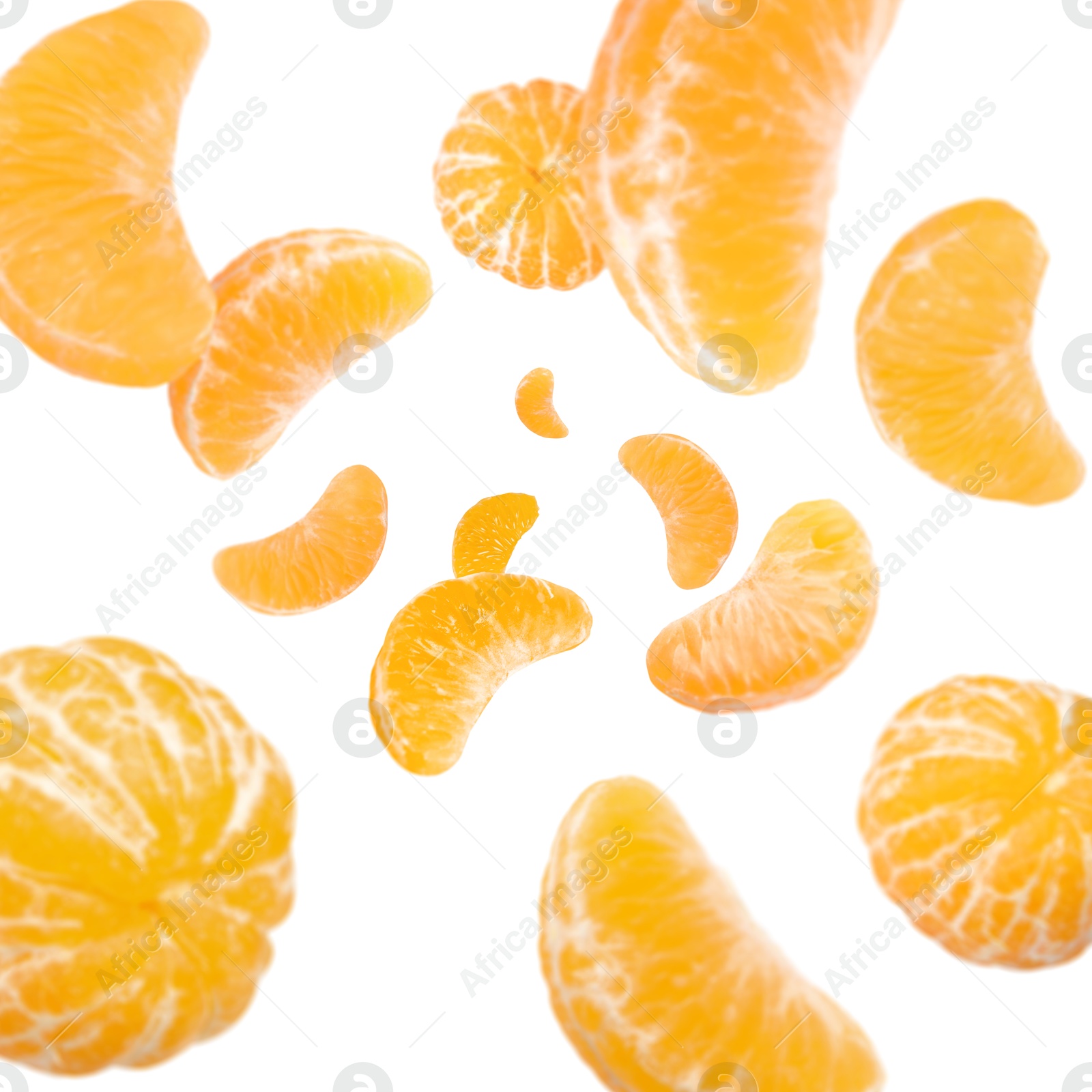 Image of Sweet tangerines whirling in air against white background