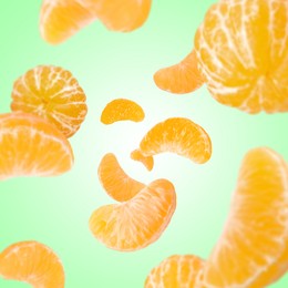 Image of Sweet tangerines whirling in air against aquamarine gradient background