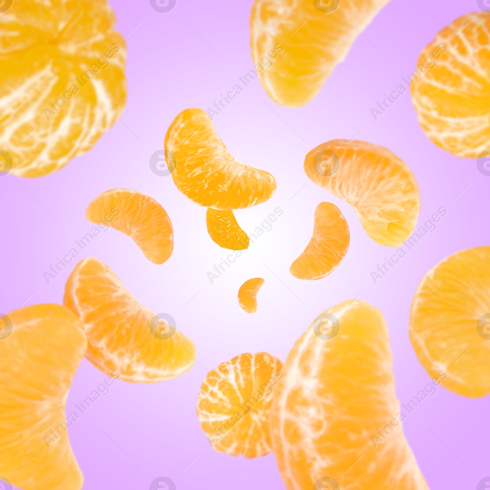 Image of Sweet tangerines whirling in air against violet background