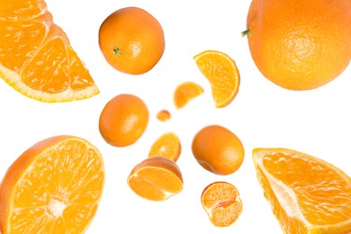 Image of Sweet tangerines whirling in air against white background