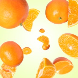 Image of Sweet tangerines whirling in air against beige gradient background