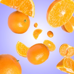 Image of Sweet tangerines whirling in air against blue violet gradient background