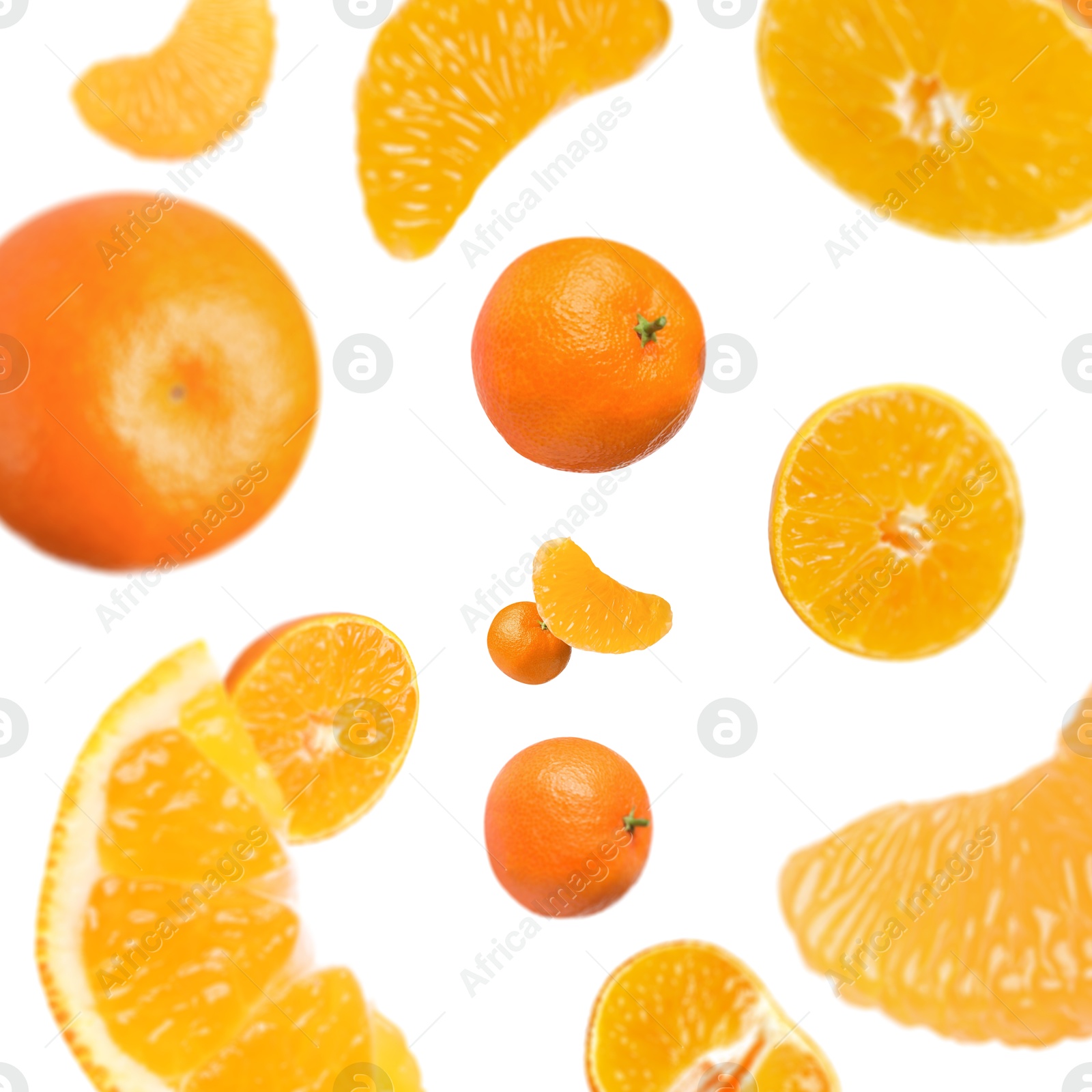 Image of Sweet tangerines whirling in air against white background