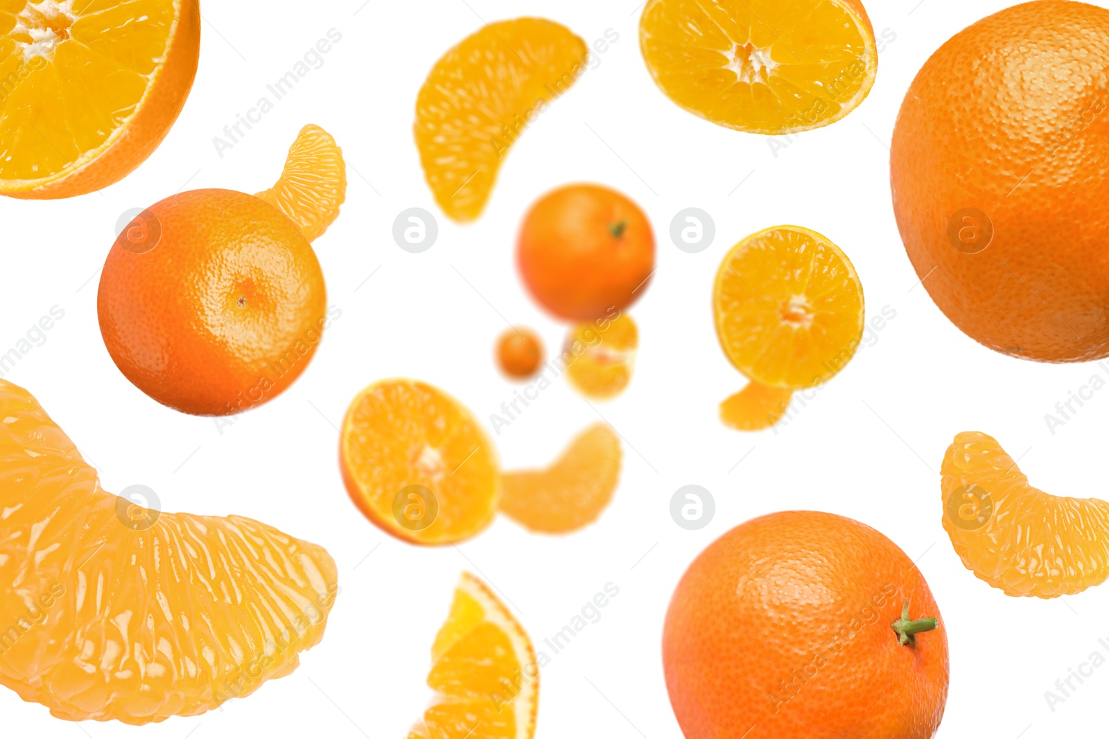 Image of Sweet tangerines whirling in air against white background