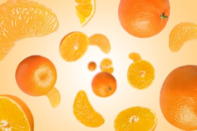 Image of Sweet tangerines whirling in air against pale orange background