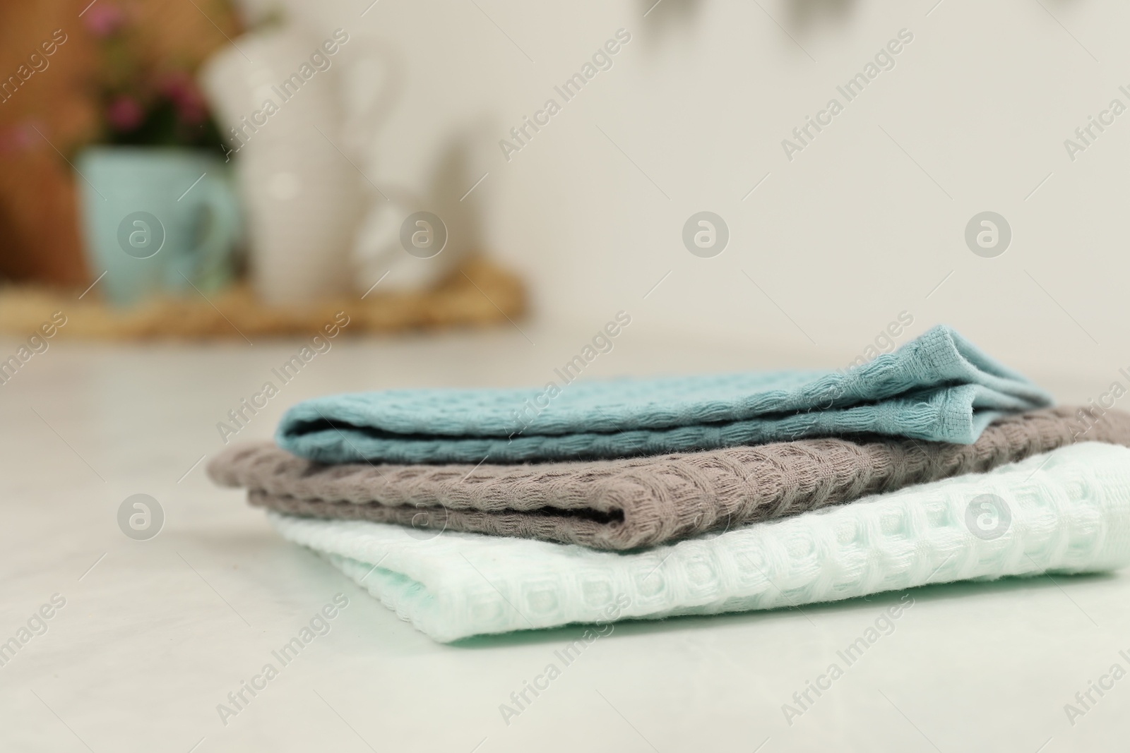 Photo of Clean waffle towels on white table, closeup