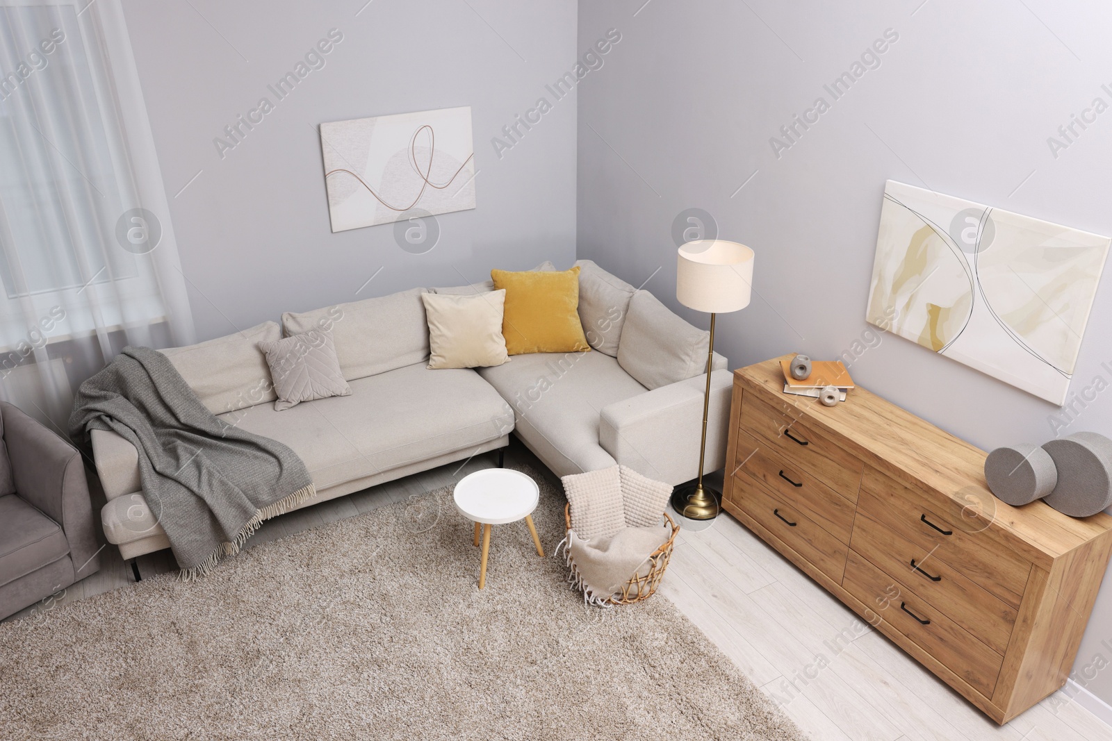 Contemporary furniture, lamp and decor in stylish living room, above view. Interior design Photo of Contemporary furniture, lamp and decor in stylish living room, above view. Interior design