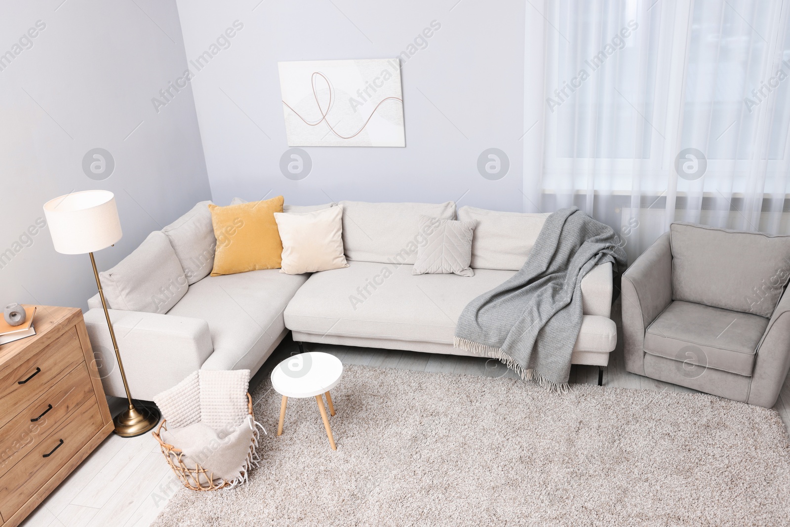 Contemporary furniture, lamp and decor in stylish living room, above view. Interior design Photo of Contemporary furniture, lamp and decor in stylish living room, above view. Interior design