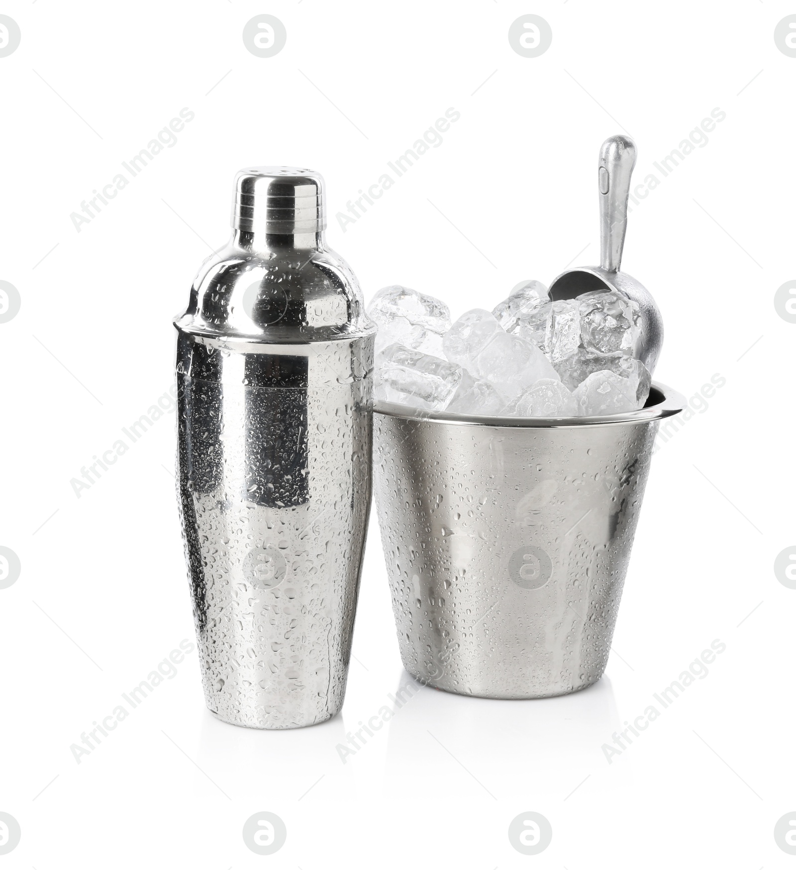 Ice in bucket and metal cocktail shaker isolated on white Photo of Ice in bucket and metal cocktail shaker isolated on white