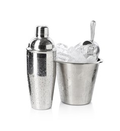 Photo of Ice in bucket and metal cocktail shaker isolated on white
