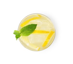 Photo of Tasty cocktail with lemon slices and mint in glass isolated on white, top view
