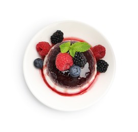 Photo of Tasty panna cotta with berries and jam isolated on white, top view