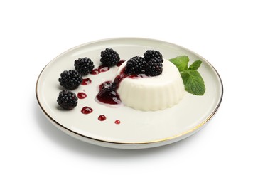 Photo of Tasty panna cotta with blackberries, mint and sauce isolated on white