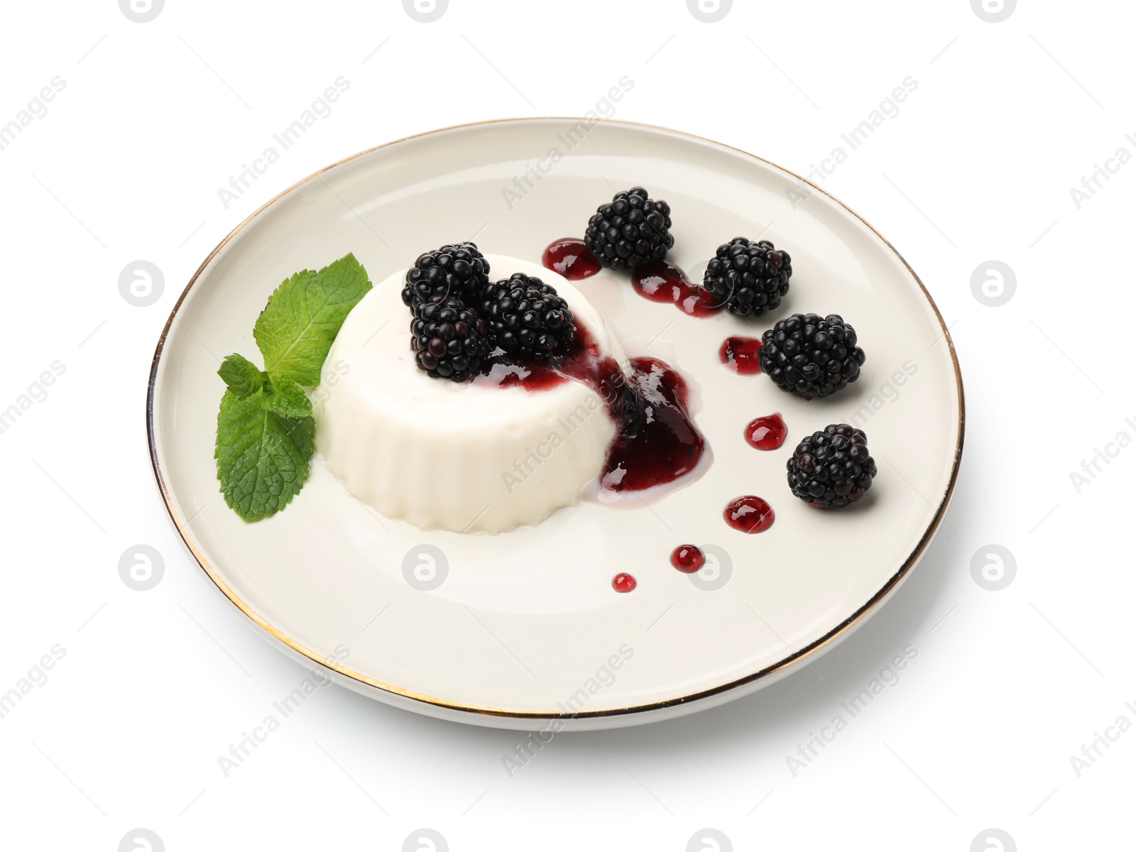 Tasty panna cotta with blackberries, mint and sauce isolated on white Photo of Tasty panna cotta with blackberries, mint and sauce isolated on white