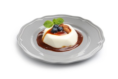Photo of Tasty panna cotta with blueberries, almonds and sauce isolated on white