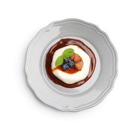 Photo of Tasty panna cotta with blueberries, almonds and sauce isolated on white, top view