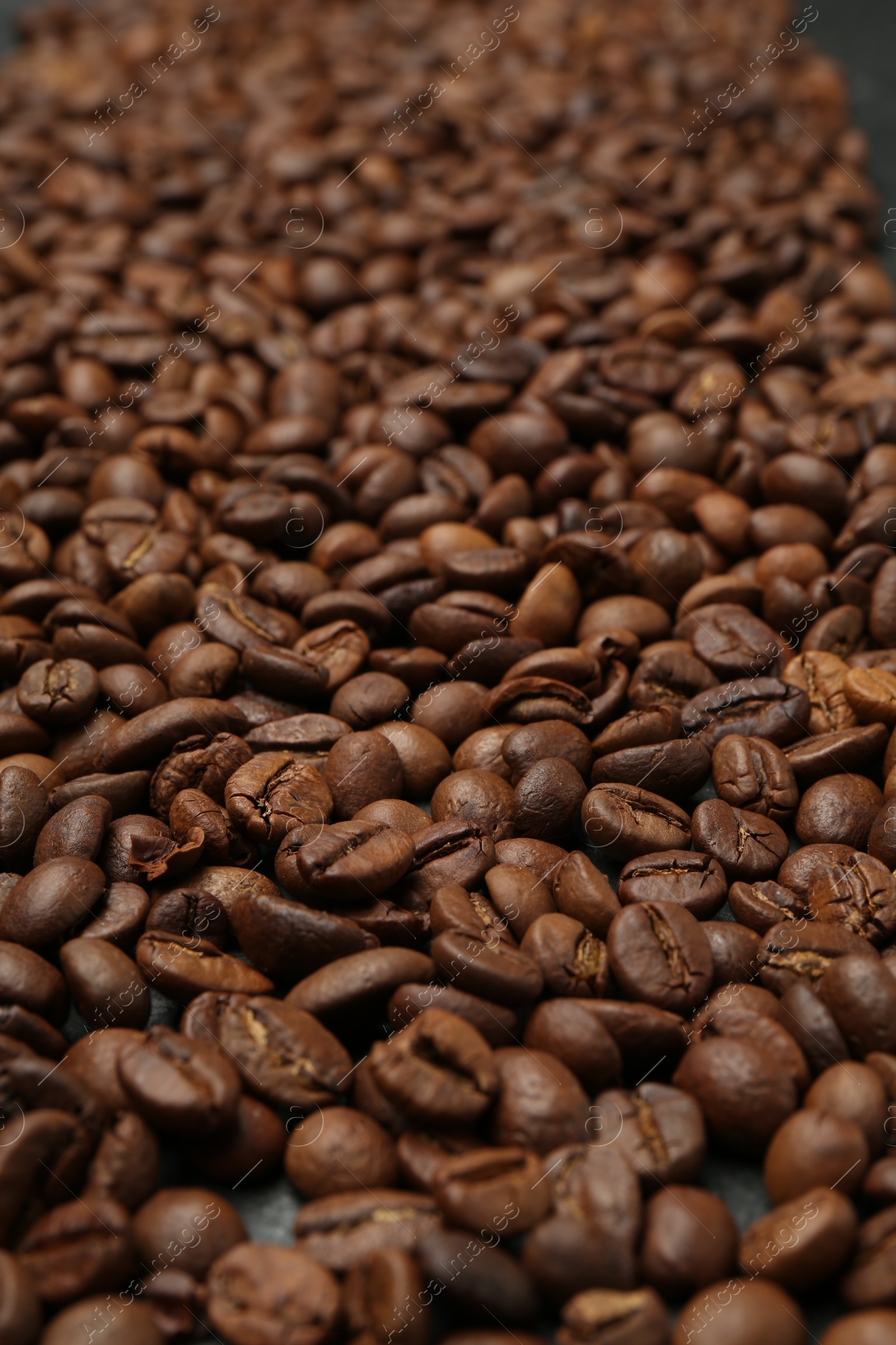 Aromatic coffee beans as background, closeup view Photo of Aromatic coffee beans as background, closeup view