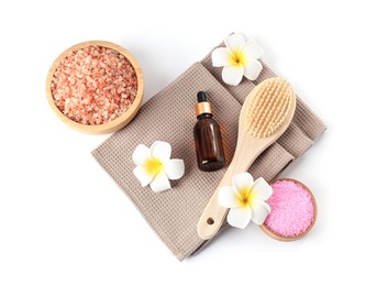 Photo of Clean waffle towels, plumeria flowers and spa products isolated on white, top view
