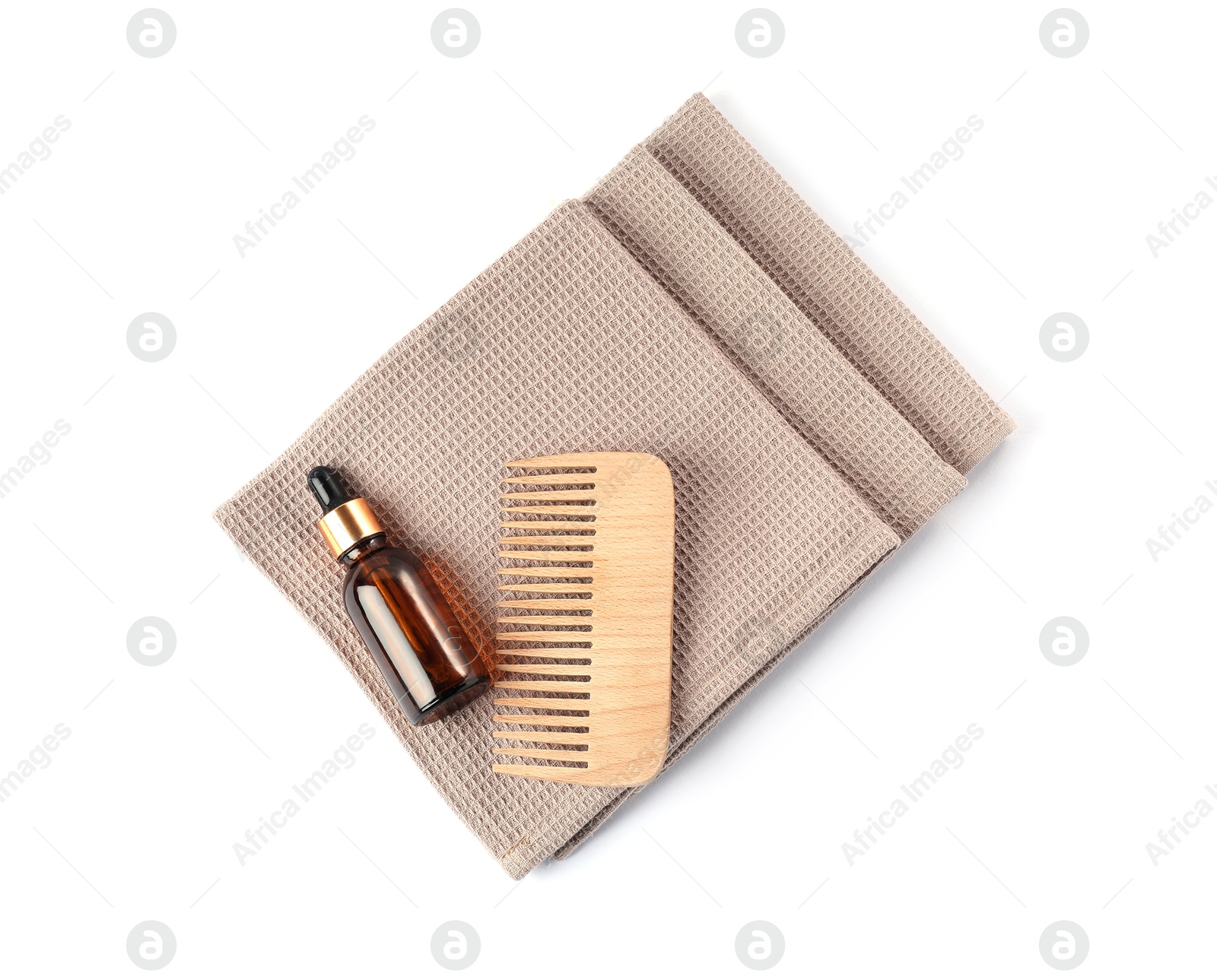 Photo of Clean waffle towels, dropper and comb isolated on white, top view