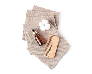 Photo of Clean waffle towels, cotton flower and spa products isolated on white, top view