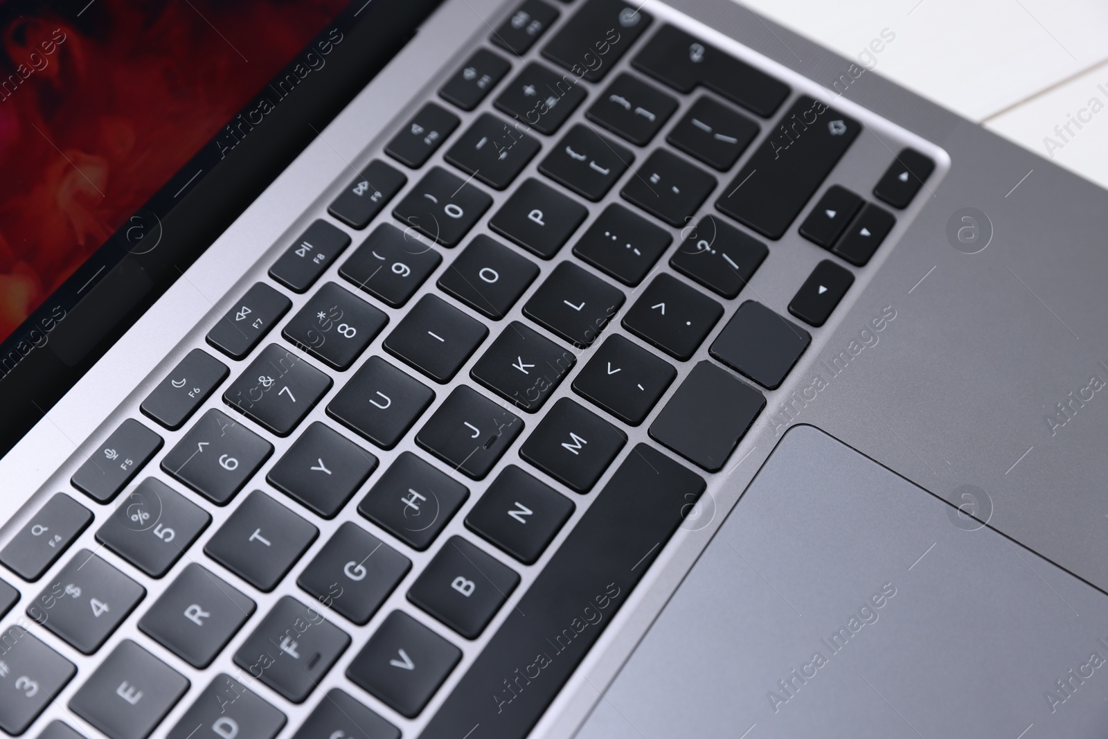 Laptop keyboard on white table, above view Photo of Laptop keyboard on white table, above view